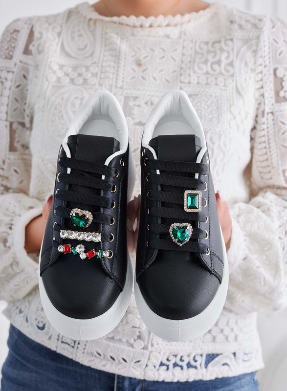 Black sneakers with green jewel embellishments