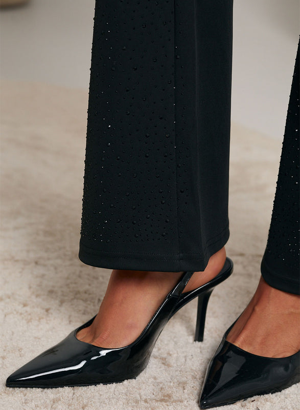 Pantaloni neri bootcut decorati con strass