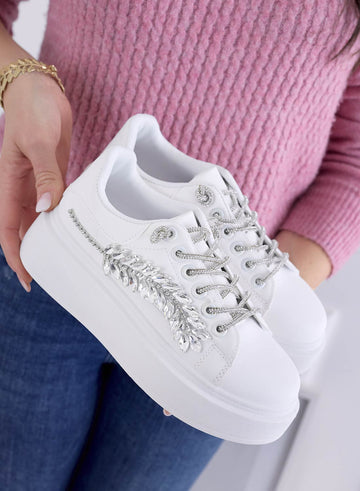 White sneakers with jewel embellishments