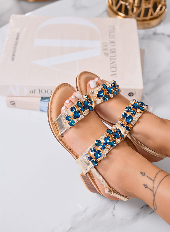 VITTORIA - Sandalias oro de joya con tacón bajo y strass azul