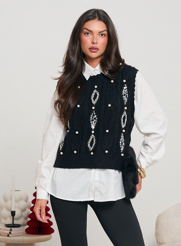 Pantaloni neri bootcut decorati con strass