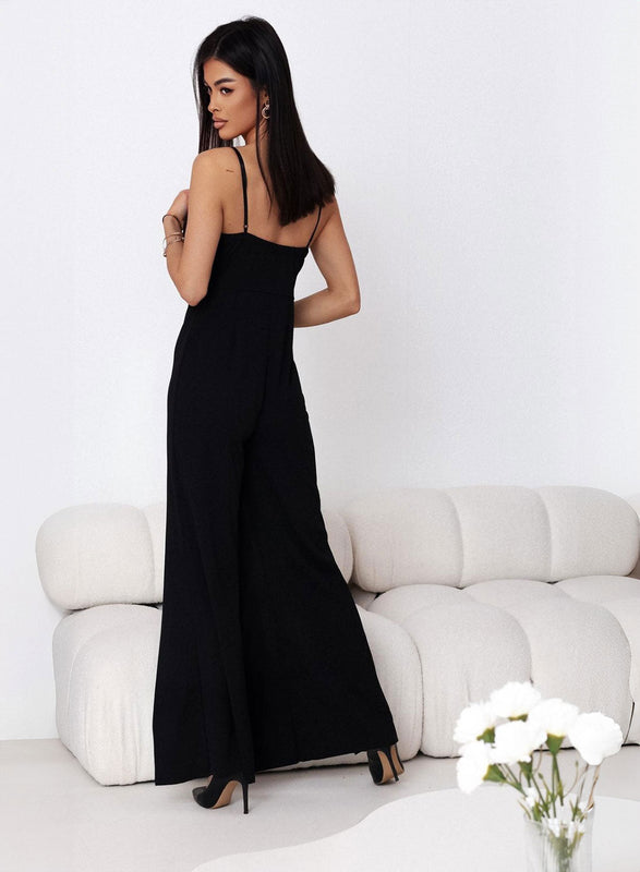 Mono elegante negro con aberturas en las piernas