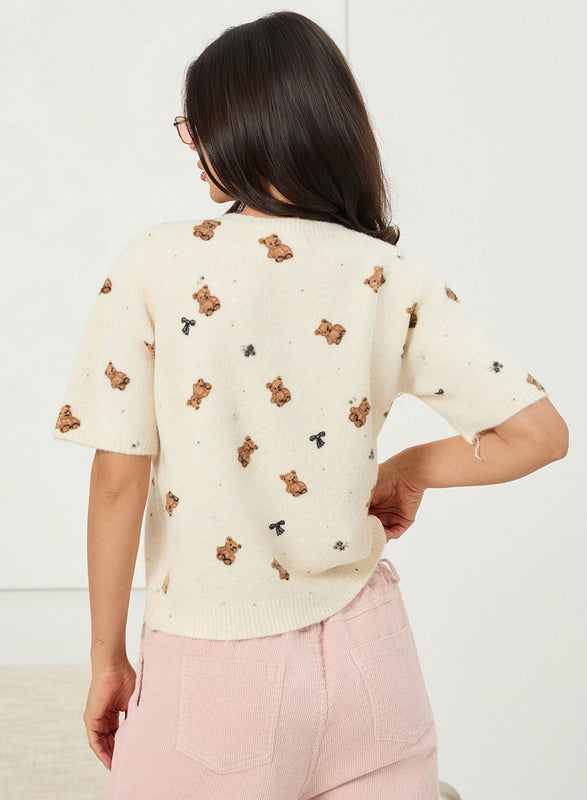 Pull beige doux à motif teddy