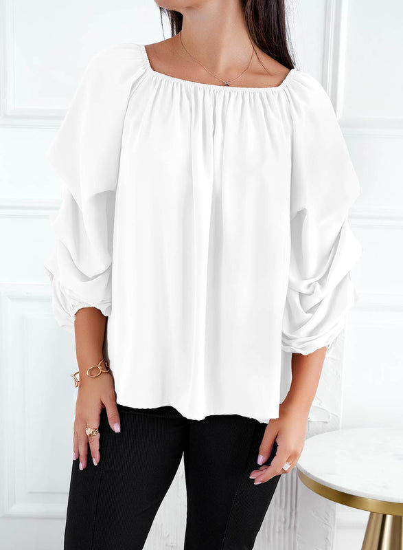 Blusa blanca con mangas fruncidas