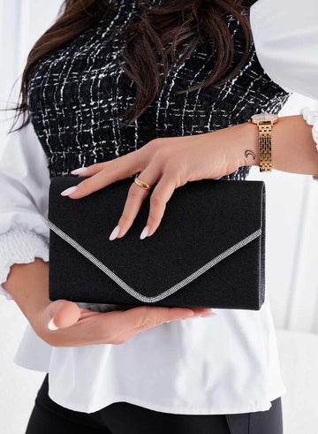 Bolso clutch negro con purpurina y ribete de strass B235