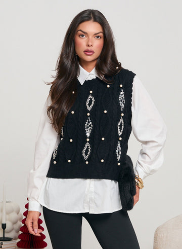 White shirt with black vest decorated with sequins and beads