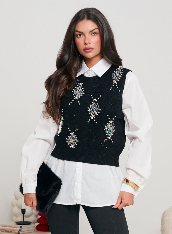 White shirt with black vest decorated with sequins and beads