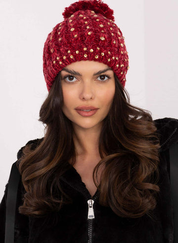 Red padded hat with rhinestones and pompom