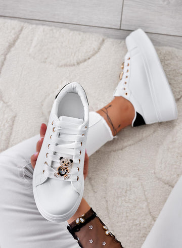 White sneakers with black heel and jeweled teddy bear