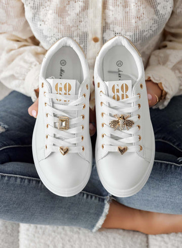 White sneakers with jewel appliqués and gold heel