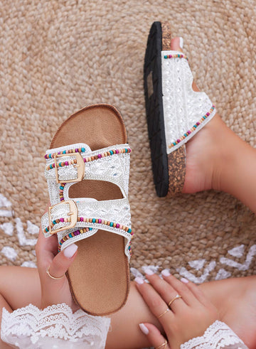 White slide sandals with rhinestones and multicolor beads