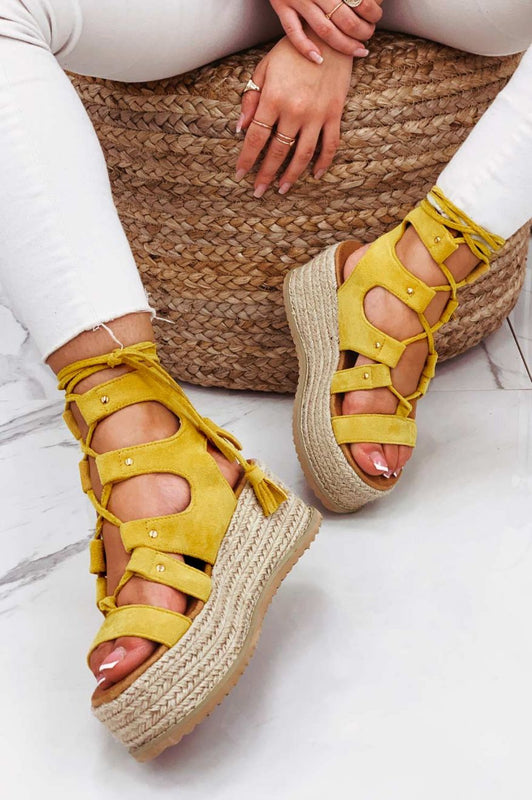 Yellow lace-up sandals with rope wedge