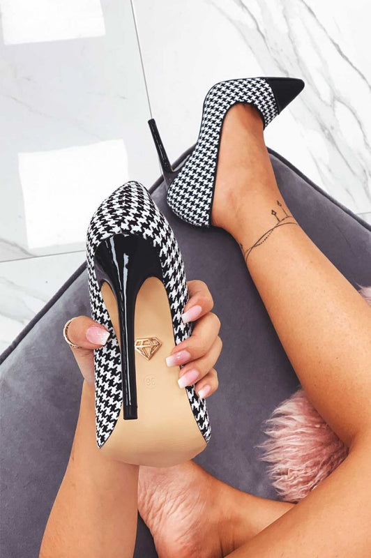 Black houndstooth pumps with patent leather heel and toe