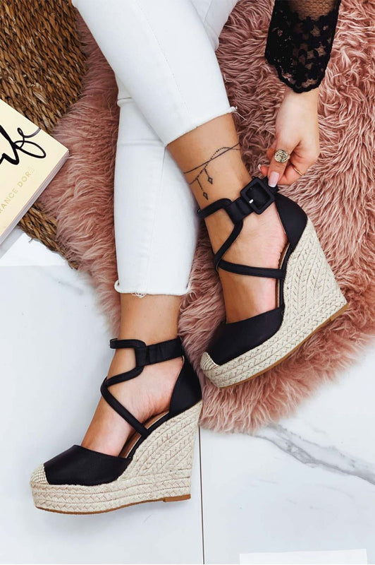 Black faux leather espadrilles with wedge heel and crossover straps