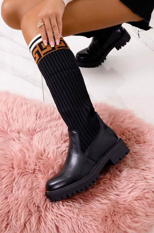 Bottes noires avec tige en tissu élastique