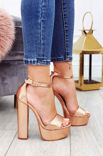 Metallic rose gold sandals with high heel and ankle strap