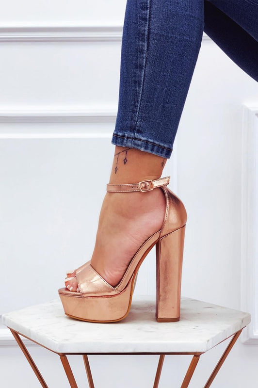 Metallic rose gold sandals with high heel and ankle strap