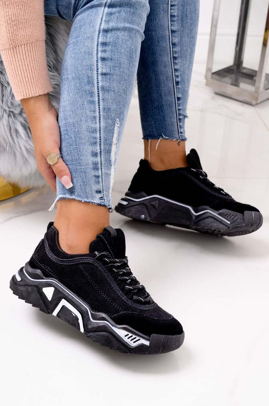 Black suede sneakers with thick sole and laces