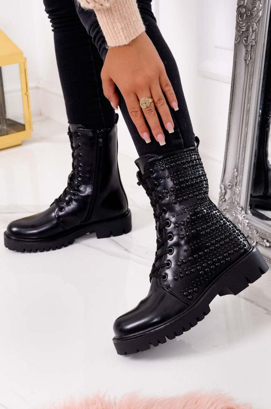 Black combat ankle boots with studs