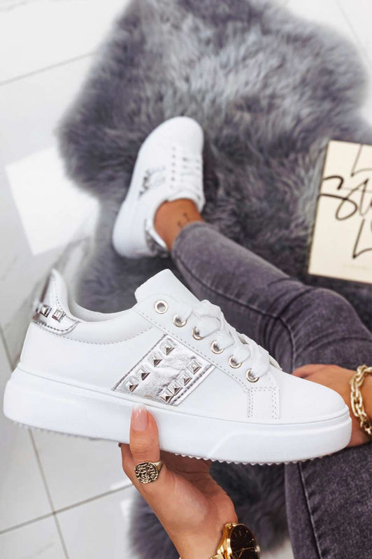 White sneakers with silver inserts and studs
