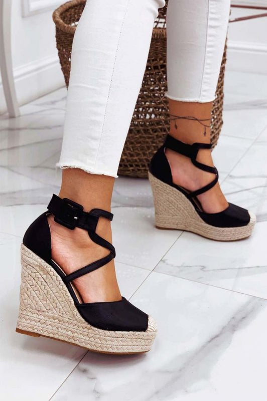 Black faux leather espadrilles with wedge heel and crossover straps