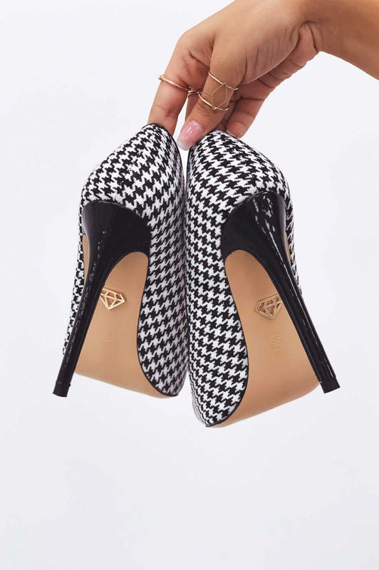 Black houndstooth pumps with patent leather heel and toe