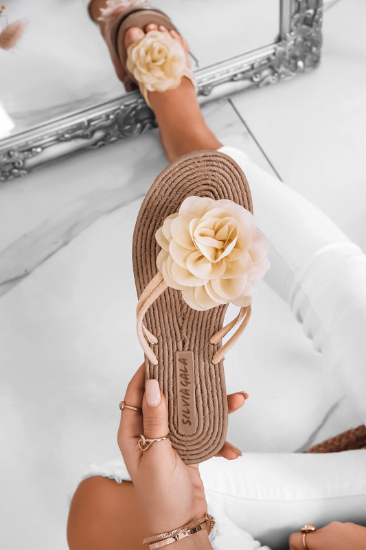 Beige slide sandals with applied flower