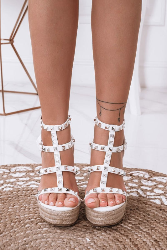 White wedge sandals with laces and silver studs