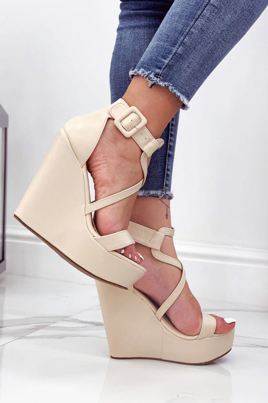 Beige faux leather wedge sandals