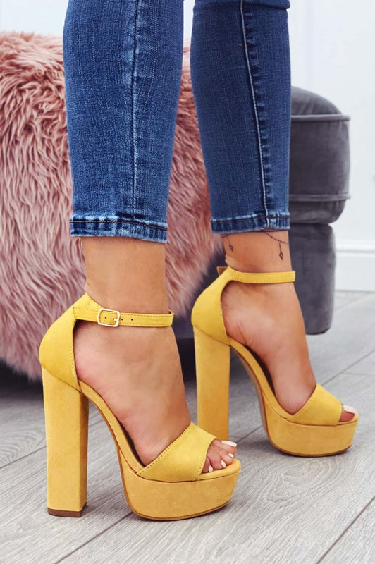 Yellow suede sandals with high heel and ankle strap