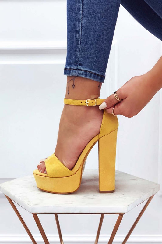 Yellow suede sandals with high heel and ankle strap