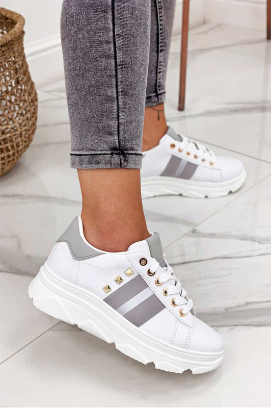 White sneakers with studs and silver inserts