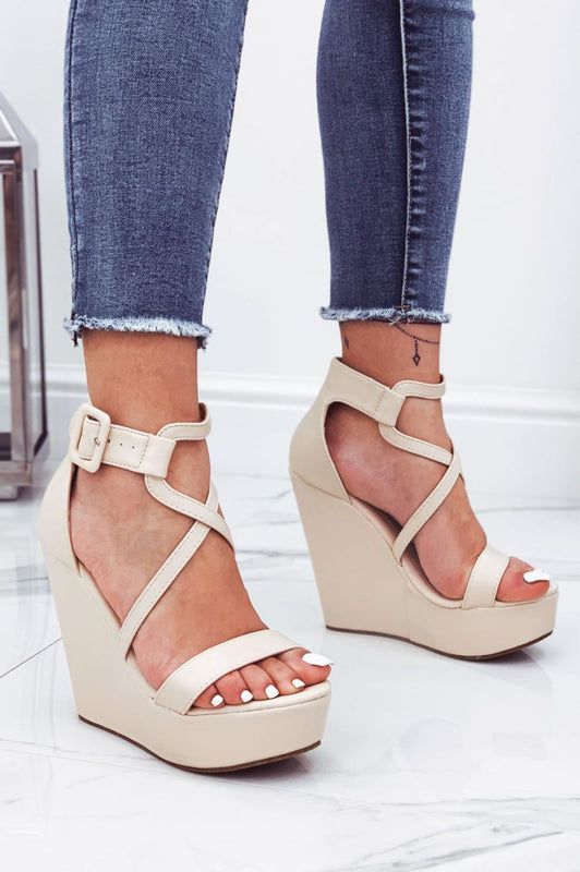 Beige faux leather wedge sandals