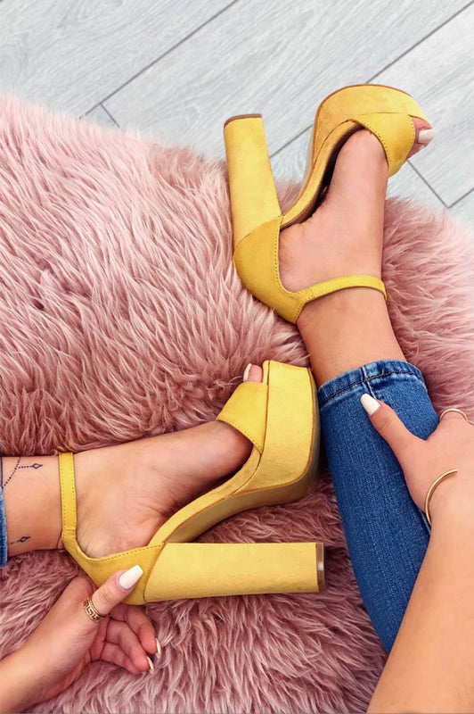 Yellow suede sandals with high heel and ankle strap