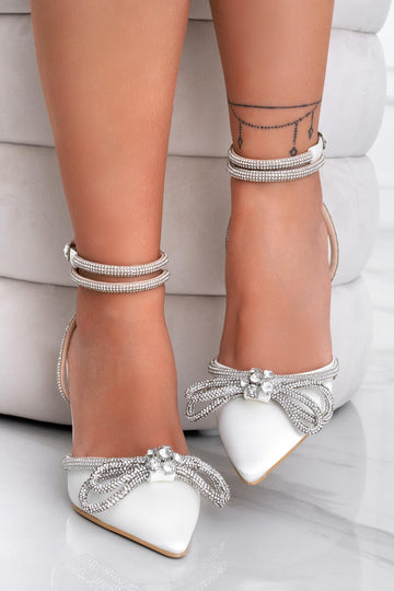 White pumps with strap and jeweled bow