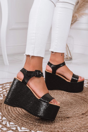 Black python-effect sandals with platform wedge